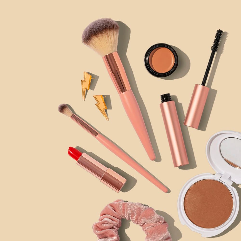 A collection of makeup brushes and cosmetics